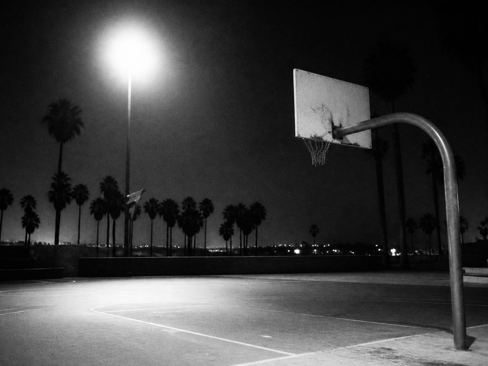 Empty basketball court at night